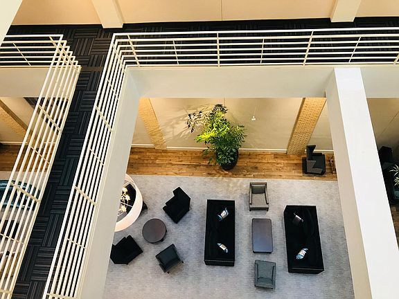 walkway opens down to atrium - 127 N Tryon St