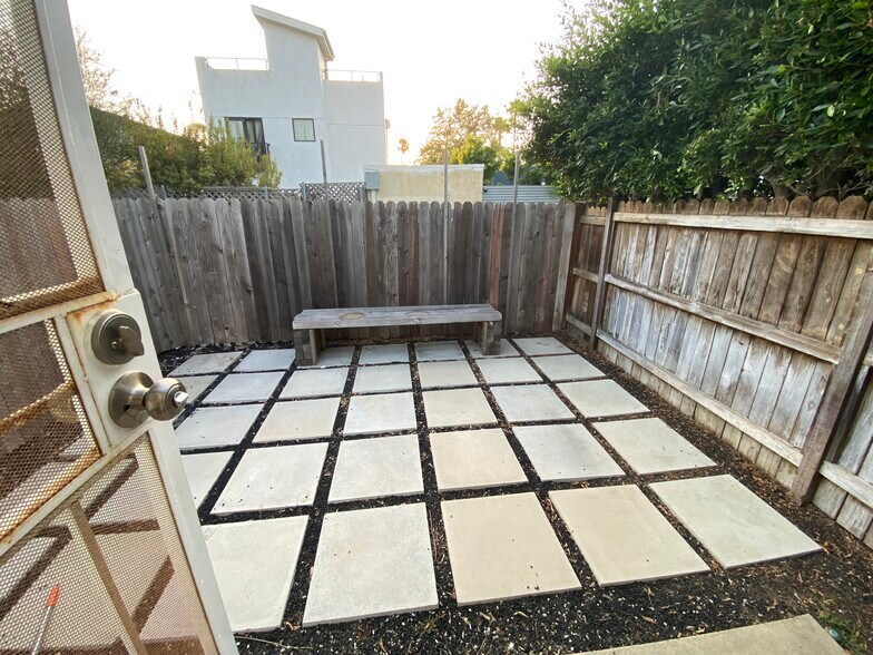 Private yard - looks amazing with some outdoor furniture and plants! - 935 Victoria Ave