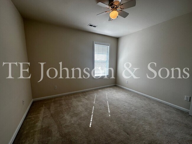 Building Photo - Spacious 3 Bedroom Home with Primary Suite on Main, Gas Fireplace & Patio in Advance!