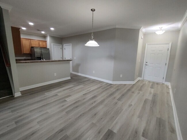 Building Photo - BRAND NEW FLOORING & FRESH PAINT - 3 Bedroom/2.5 Bath Townhome with garage in Wild Wing!