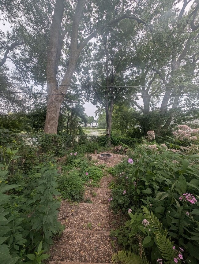Building Photo - Charming Garden Oasis in West St. Paul – Fire Pit, Pond & Prime Location!
