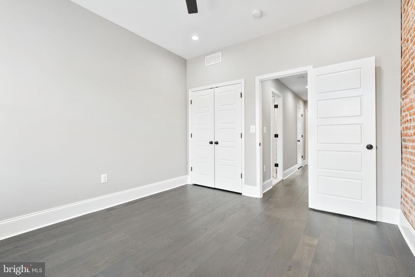 Medium Bedroom showing the closet and the hallway with the private bathroom on left side (2 of 2) - 263 S Robinson St