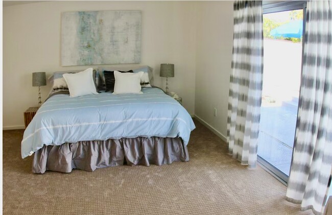 Large primary bedroom off the pool with ample closet space and en suite bathroom - 2080 E McManus Dr