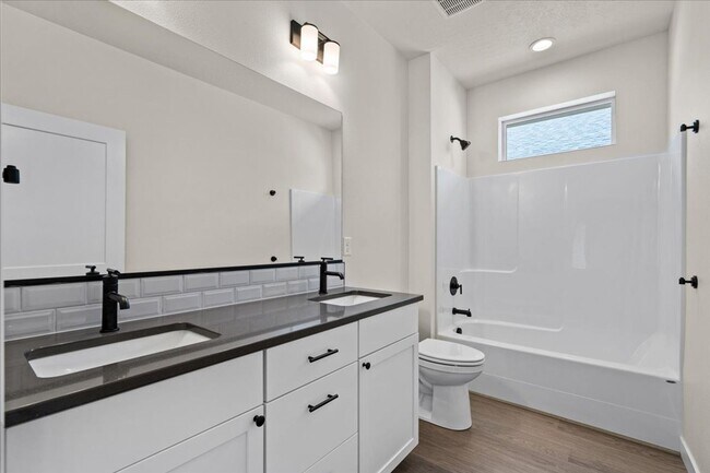 Building Photo - Brand New, Stylish 4-Bedroom Home with Vaulted Ceilings and Private Patio