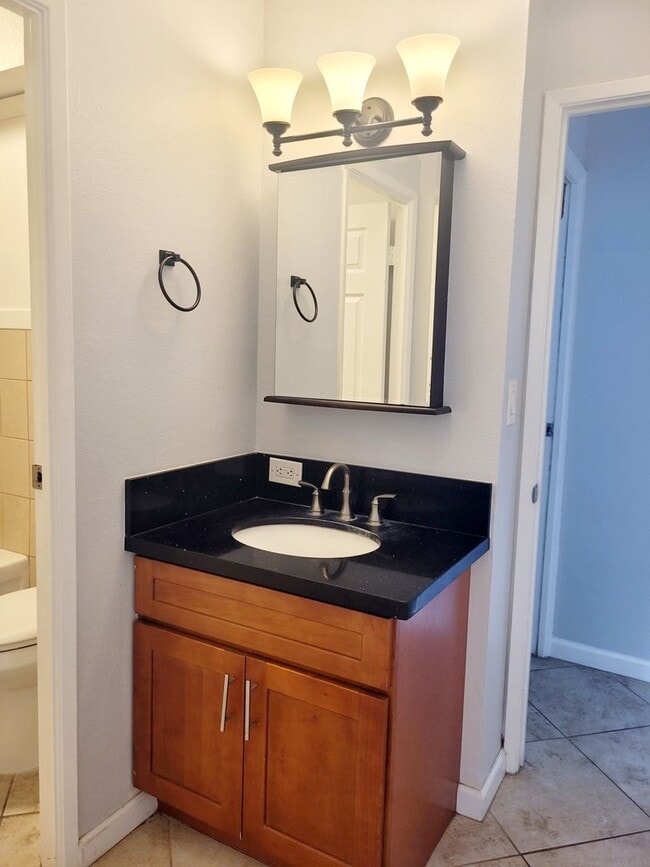 Building Photo - AVAILABLE | 2 Bedroom, 1 Bathroom Condo with 1 Assigned Parking Stall