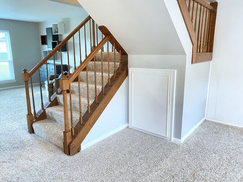 Split-level staircase with storage underneath - 11744 S Kirkwood Rd