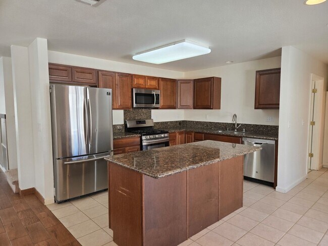 Building Photo - Spacious 4-Bedroom Home with Solar, Finished Garage, Large Pantry & Low-Maintenance Backyard in M...