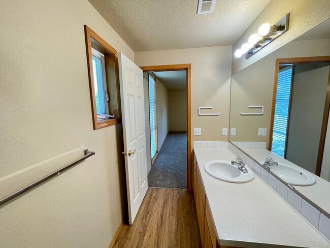 Building Photo - Spacious 4-Bedroom, 2.5-Bath Home with Deck, Fireplace & Updated Kitchen