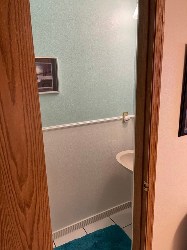 1/2 bath main floor - 8185 S Fillmore Cir