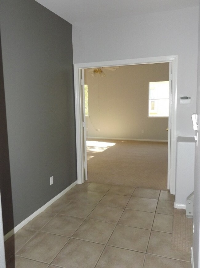 Building Photo - Gated Green Valley Ranch Townhome | 2 Bed | 2.5 Bath | 2-Car Garage