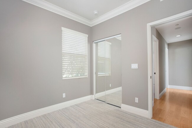 Building Photo - Lease this Gorgeous former Model Townhome ...