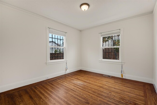 Second bedroom with great light and closet with no stanging. - 2108 E 23rd St