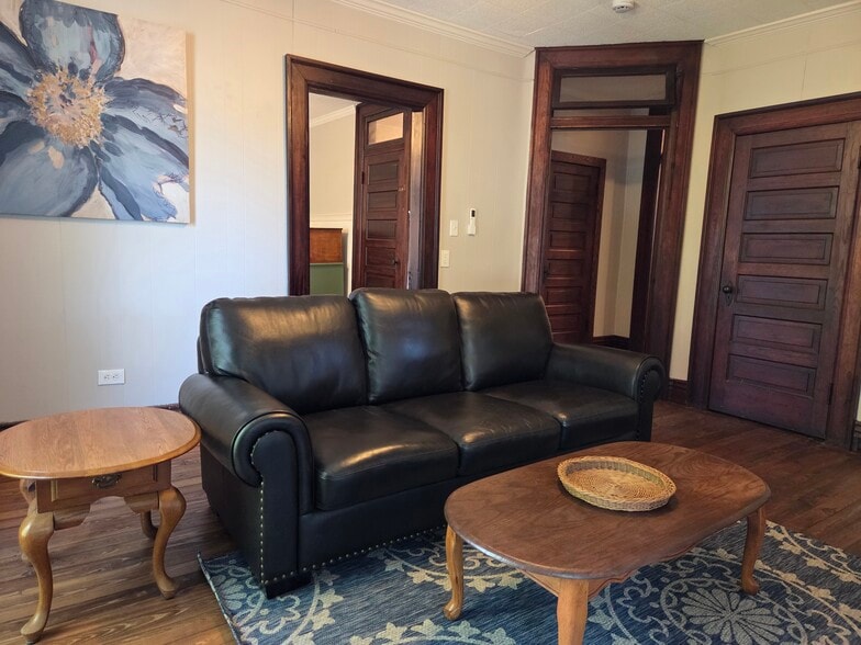 Lightly furnished unit. Living room. - 403 W Flower St