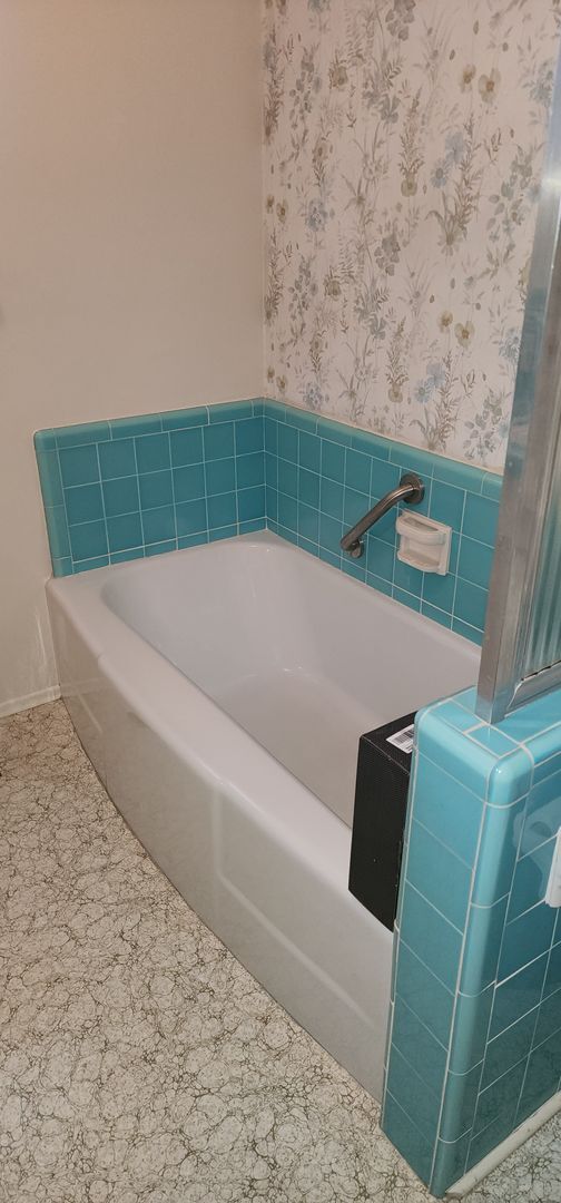 Building Photo - This is a spacious house featuring four bedrooms and two bathrooms, along with a two-car garage.