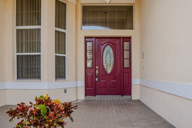 Building Photo - Spacious 5BR Home in Falcon Trace | 3-Car Garage | Screened Patio | Resort-Style Amenities Rent: ...