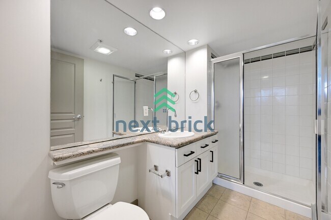 Building Photo - Stunning 2-Bed Corner Condo with Water and Mountain Views