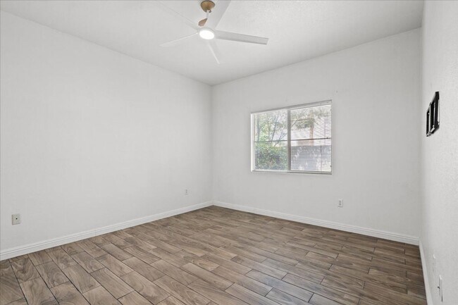 Building Photo - Charming 2-Bedroom First Floor Featuring Open Layout, Fireplace, Patio & Community Pool