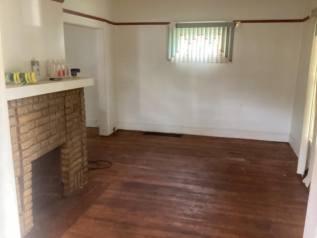 Living room with fireplance - 651 E 93rd St