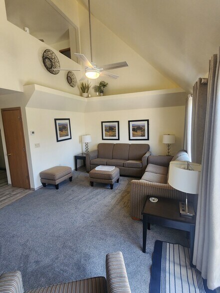 Main level living room, opens into a newly fenced in yard. "L" shaped garden ready to go!" - 1810 Briarwood Ct