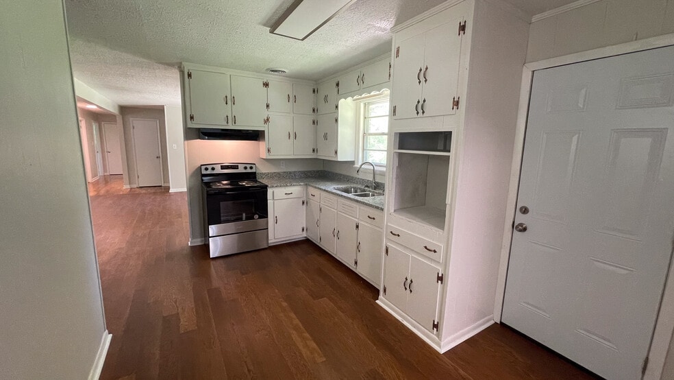 Newly Remodeled Kitchen with Stove and Fridge - 121 Drive 1417