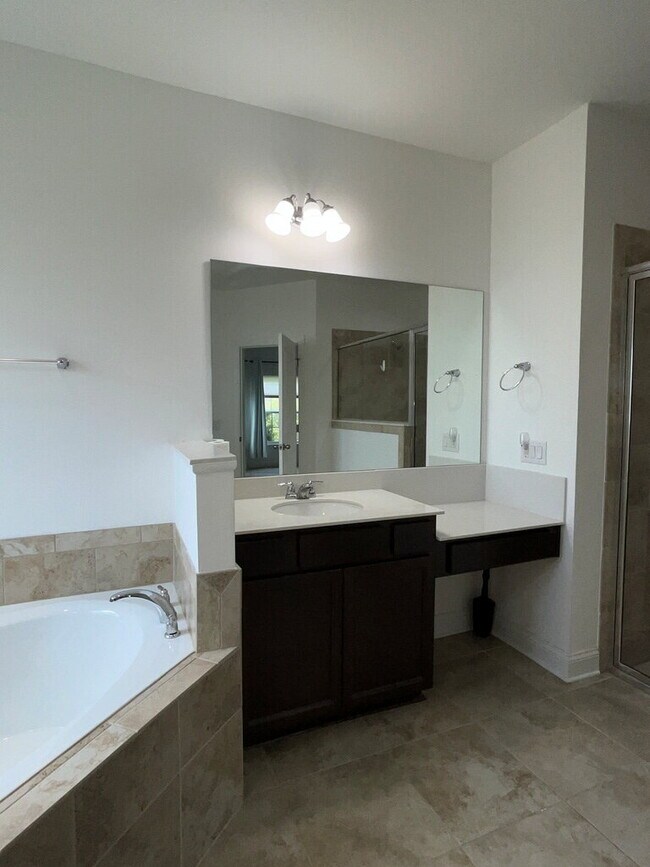 Building Photo - "Spacious 4-Bed Oasis with Stunning Lake V...