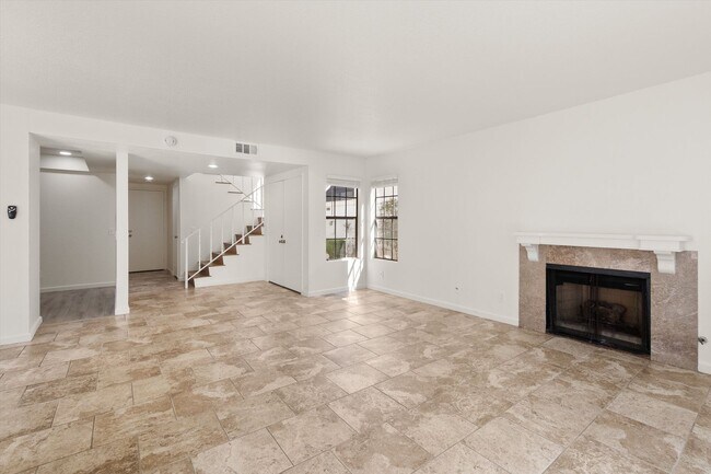 Building Photo - Large Renovated 3bed x 2.5bath Townhouse with Private Patio & 2-Car Garage