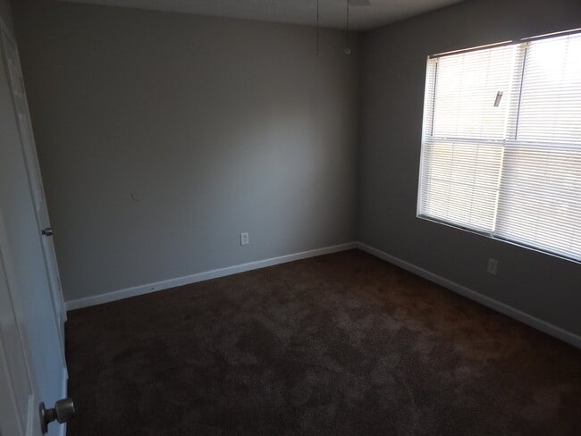 Building Photo - Freshly painted and new flooring in this 4 Bedroom 2 and Half Bath home. Covered front porch with...