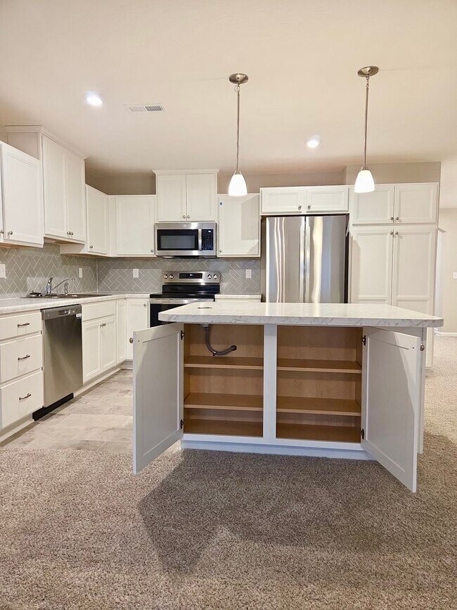 Building Photo - Exquisite just built condo with everything! Ground floor, no stairs, attached garage