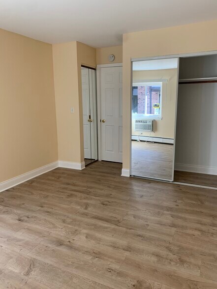 Bedroom with linen closet and closet - 1813 Hemlock Pl