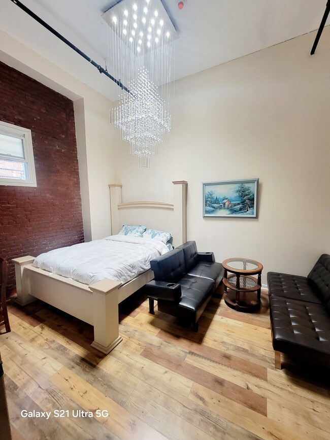 Bedroom in downstairs loft - 317 W Fayette St