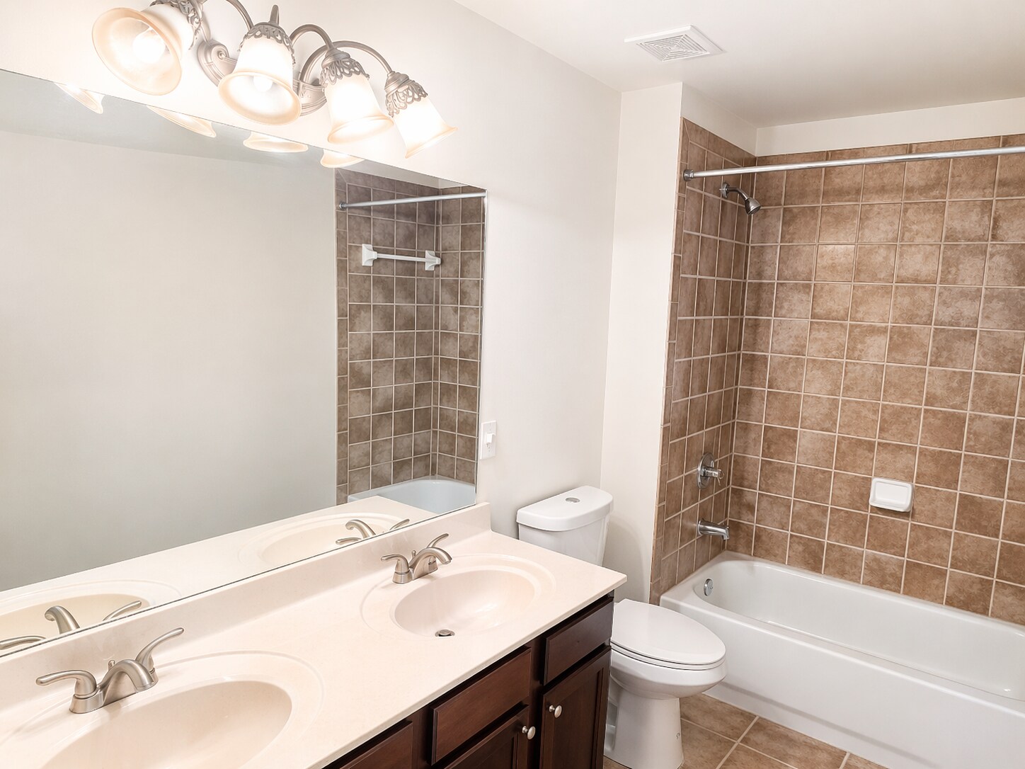 Spacious second full bathroom with double vanity for added convenience. - 2143 Somerset Pl SE