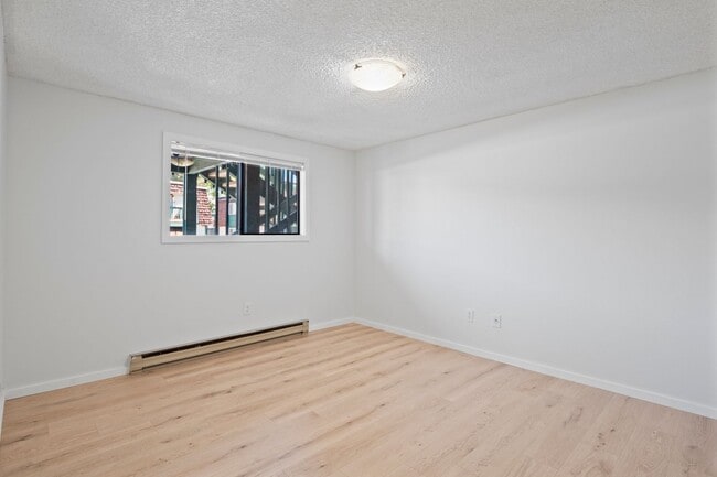 Building Photo - Spacious And Nicely Updated 2 bed 1 Bath Condo unit w/ full size laundry