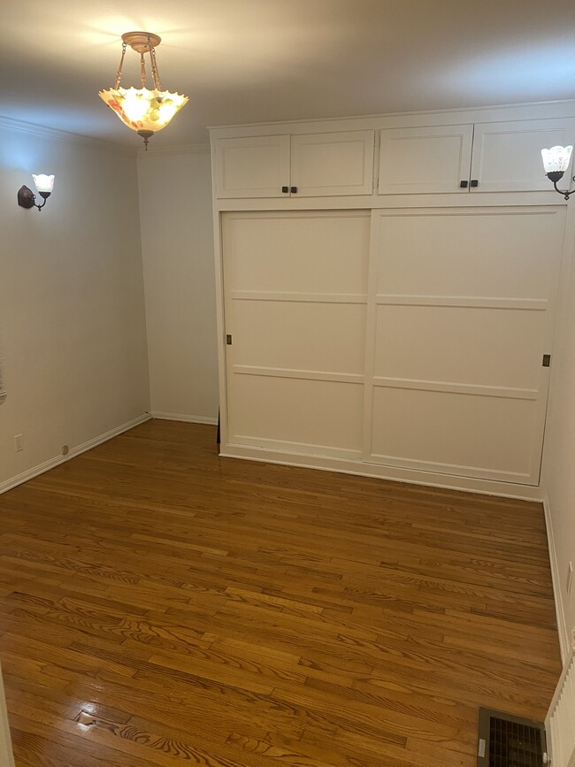 Bedroom enjoys large closet space with storage above and the window faces nature! - 1857 Pandora Ave