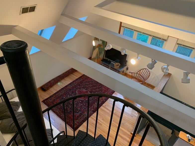 view to living room from spiral stair - 5636 Bartlett St