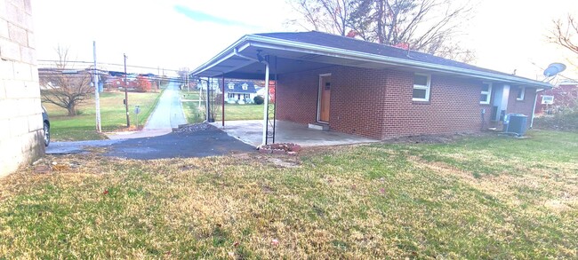 Building Photo - HALF OFF FIRST MONTH RENT! Single family brick home with full unfinished bsmt & detached garage