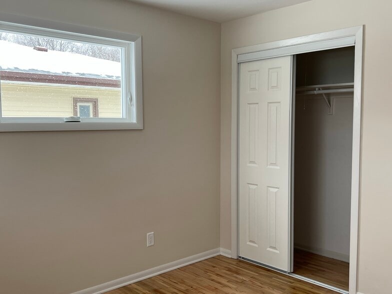 Bedroom 2 with new windows, paint, refinished floors in 2023 - 835 Maple St NE
