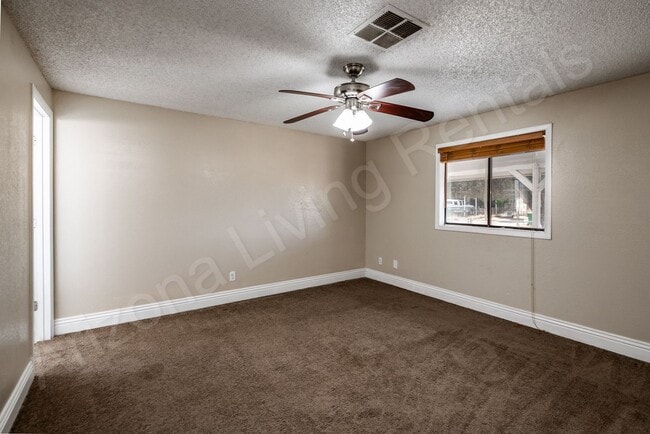 Building Photo - LARGE FENCED YARD WITH DETACHED GARAGE