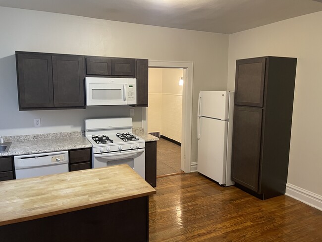 Large updated kitchen with island and new appliances - 5033 Devonshire Ave