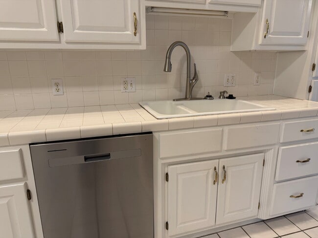 Building Photo - Elegant, Low Maintenance Townhome Designed for Elevated Everyday Living!