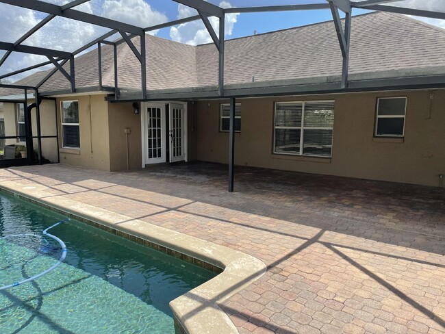 Building Photo - Beautiful 3 Bedroom 2 Bath Pool Home Lawn ...