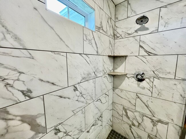 Building Photo - Practically New & Available NOW! Americana Luxury Townhomes! Pet Friendly! Attached Garage! All A...