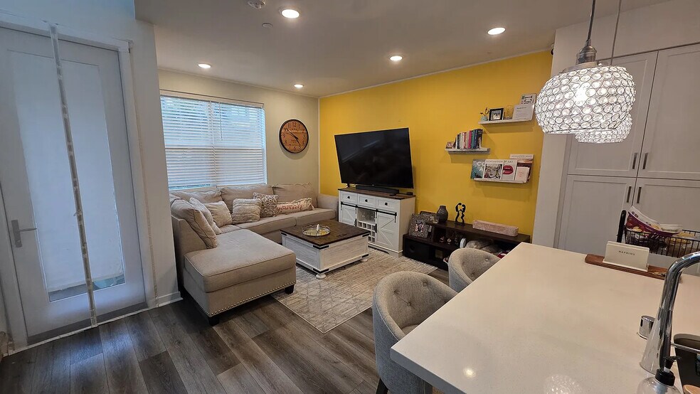 This is how the living room looks with furniture - 9610 New Morning Pl