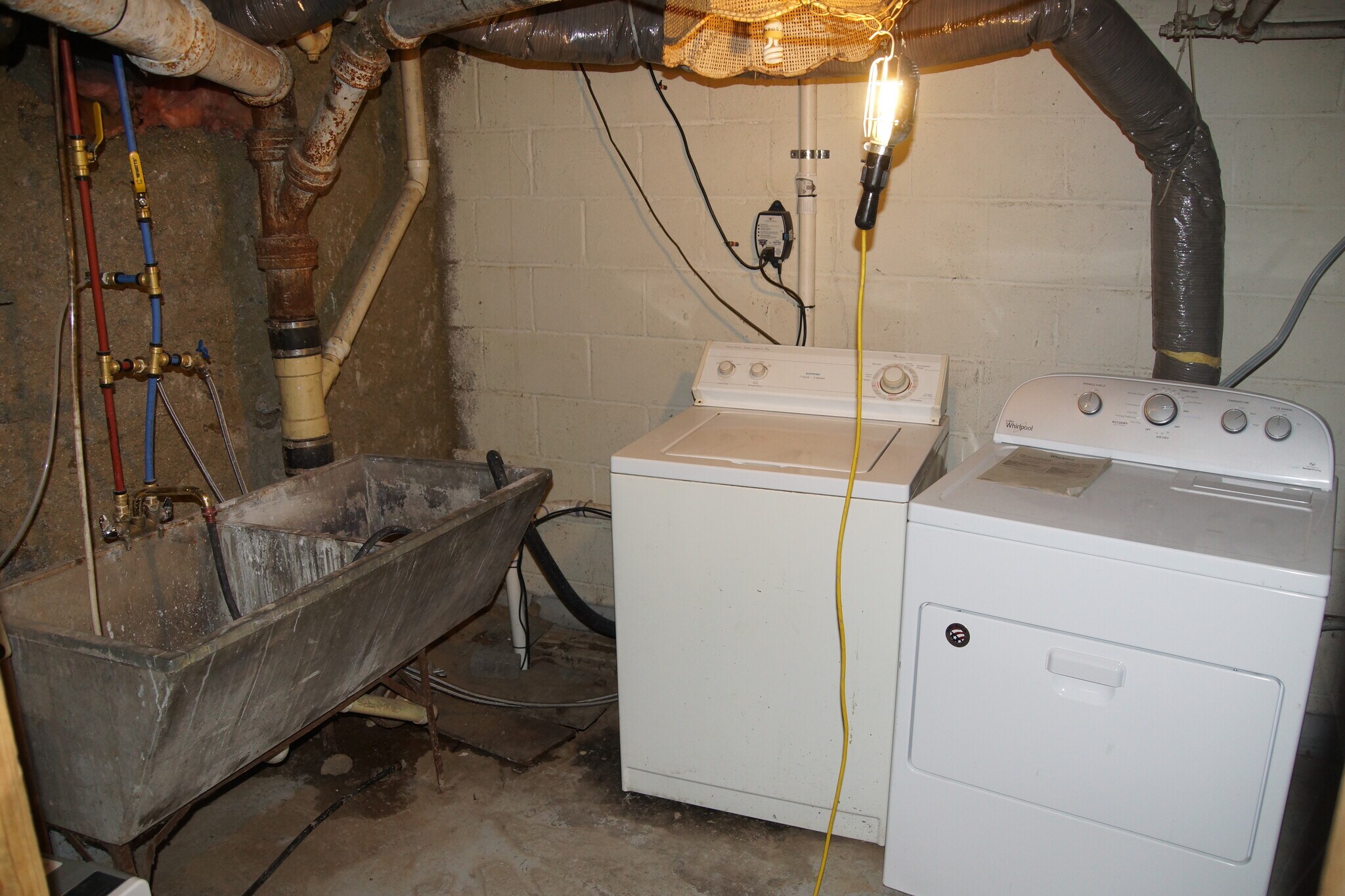 Laundry in huge unfinished basement. - 1020 Burns Ave