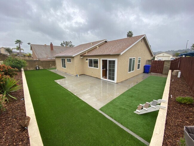 Building Photo - Remodeled 4 bedroom with central A/C and 2 car garage!