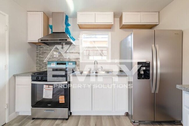 Building Photo - New 2 Bedroom House for Rent in Gifford Ave Bell CA Garage Available