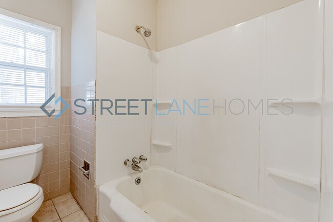 Building Photo - REDUCED! - NOW OFFERING HALF OFF FIRST FUL...