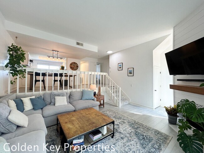 Building Photo - Welcome to this stunning ***unfurnished*** tri-level condo in the desirable Casitas de la Costa c...
