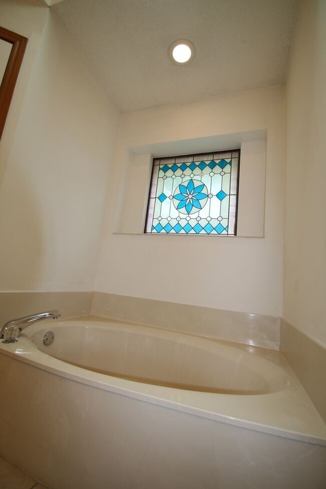 Building Photo - Corner Lot Charmer Off Chapel Creek | 4BR/2BA with Fireplace, Garden Tub & Fenced Backyard