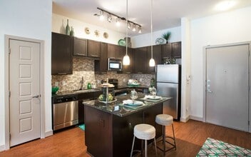 Building Photo - Boutique Living with Modern Comfort!