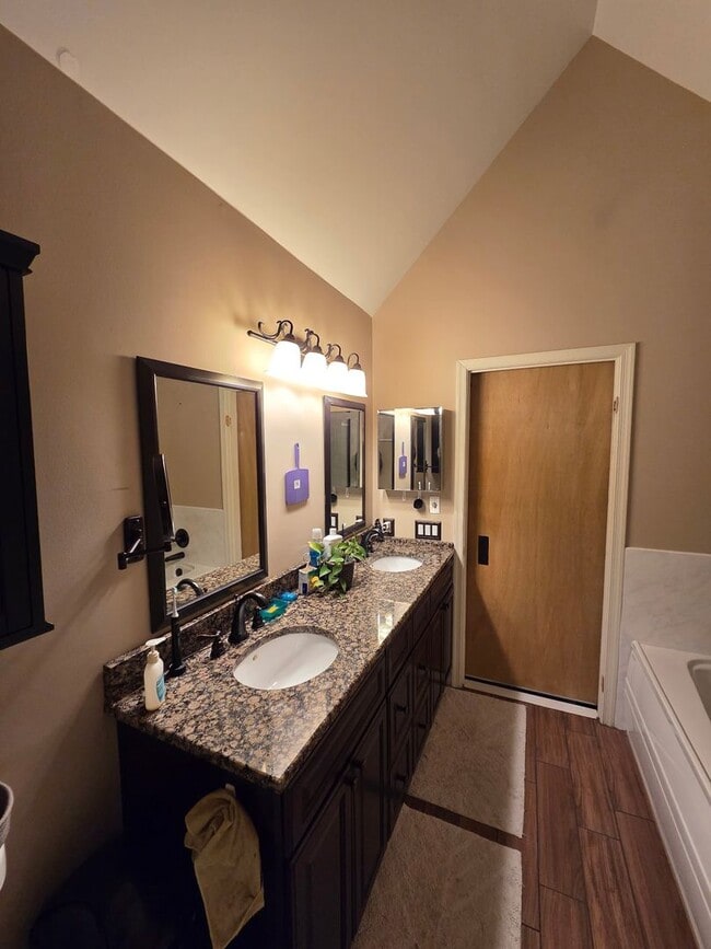 Building Photo - Stunning 3–4 Bedroom Townhome in Private Community | Garage + EV Charger | Deck with Tree Views